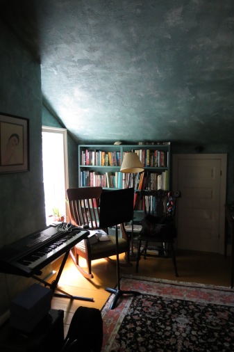 The music room above the kitchen has Vermeer-like light on the slanting ceiling.